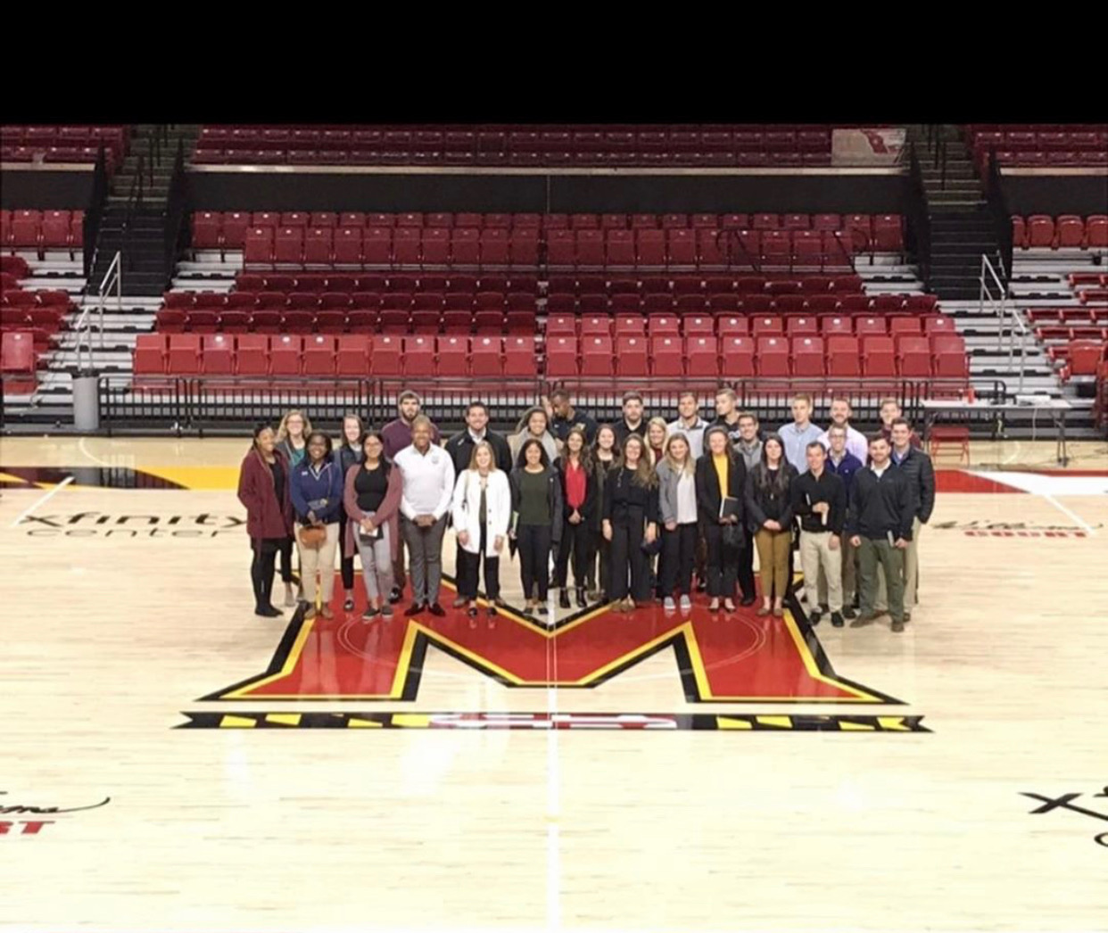 Students on basketball court at Maryland